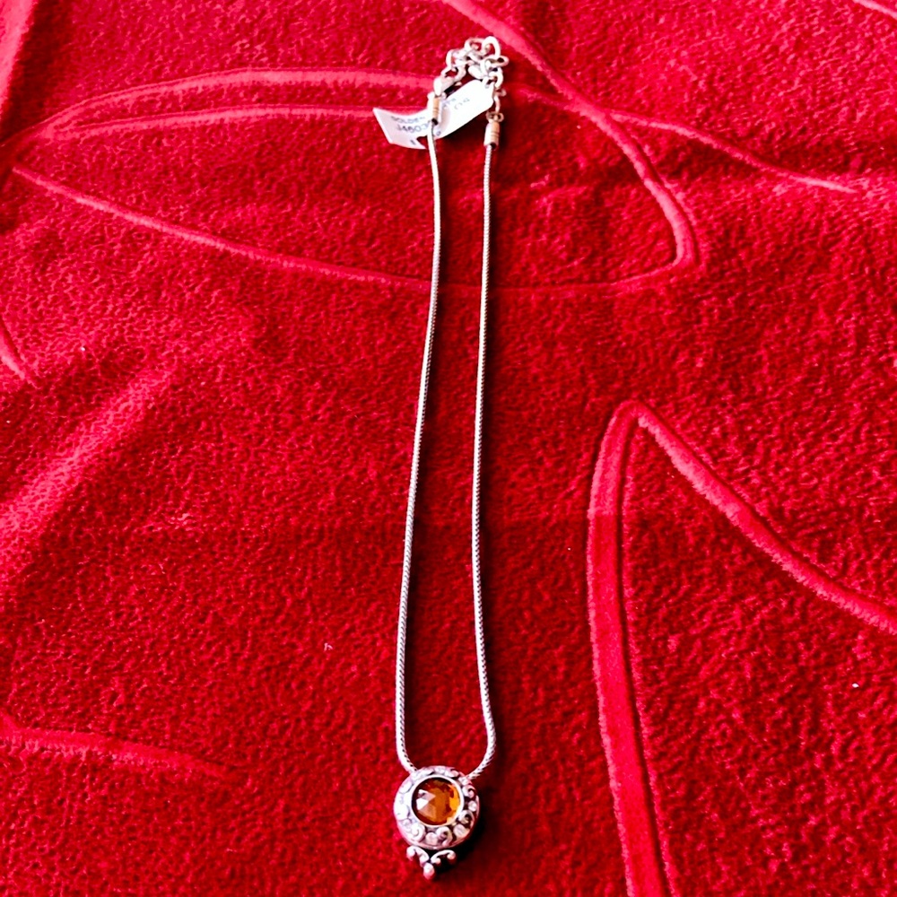 New amber stone surrounded by rhinestones